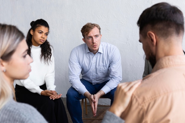 Man speaking about his issues at a group therapy session