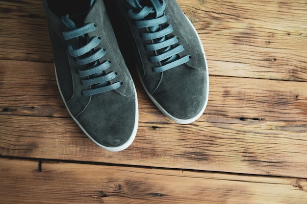 Man  sport shoes on the wooden background