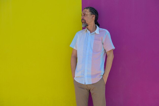 Man standing against colorful wall