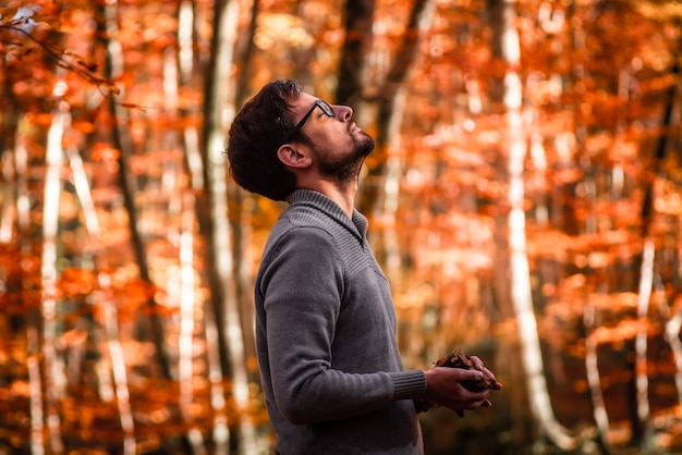 Man standing in autumnal beech forest