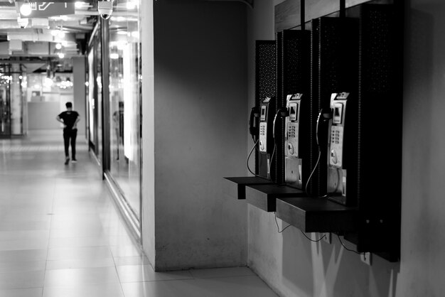 Man standing in corridor of building