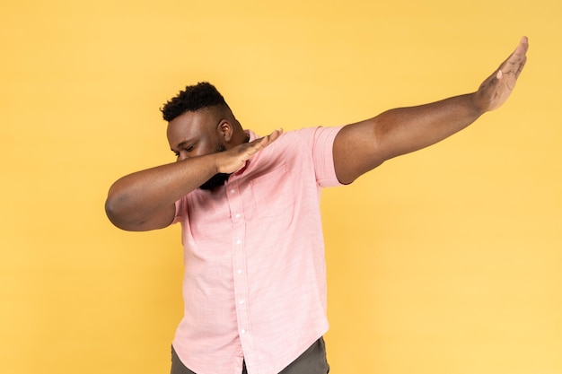 Man standing in dab dance pose celebrating success popular internet meme