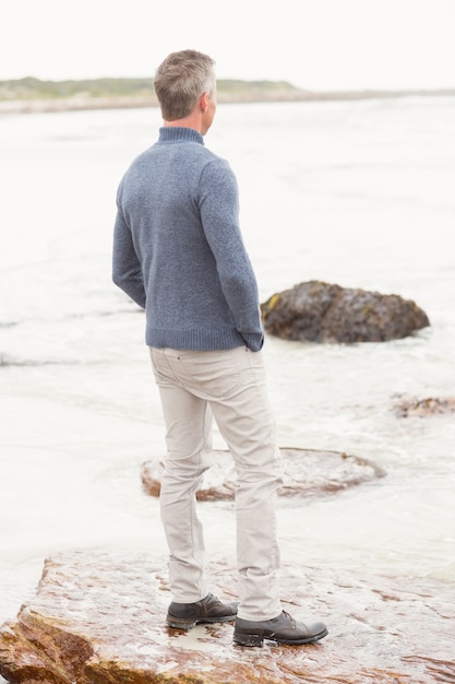 Man standing on a large rock