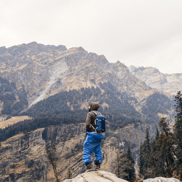 Man standing on mountain against sky