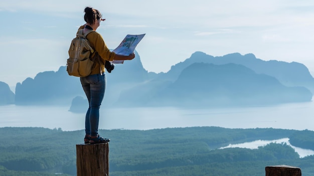 man standing on mountain against sky