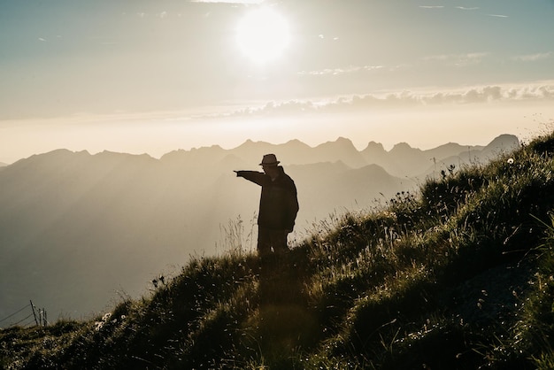 Man standing on mountain against sky