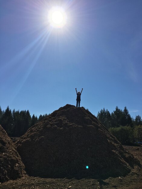 Man standing on street against sky