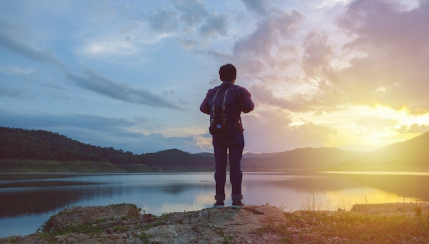 Man standing and watching the sunset