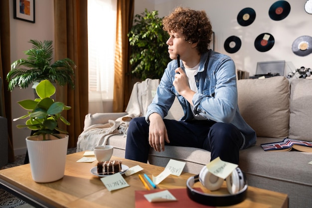 A man stares out the window memorizing new vocabulary words from a foreign language