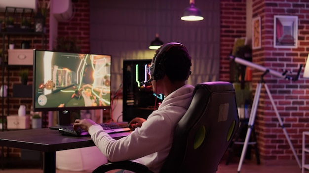 Man streaming online multiplayer first person shooter surprised\
after losing online competition on gaming pc. african american\
gamer cannot believe failing level in first action game\
tournament.