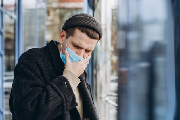 Man in the street wearing protective masks.