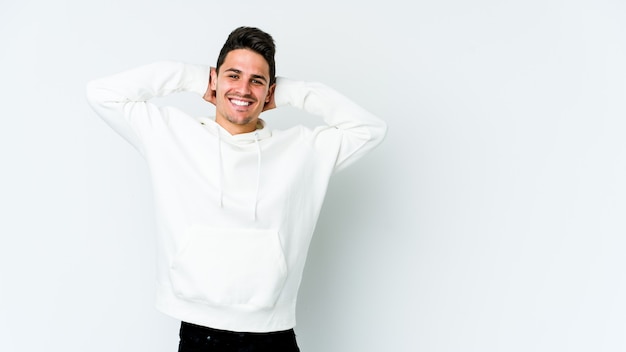 Man stretching arms in studio