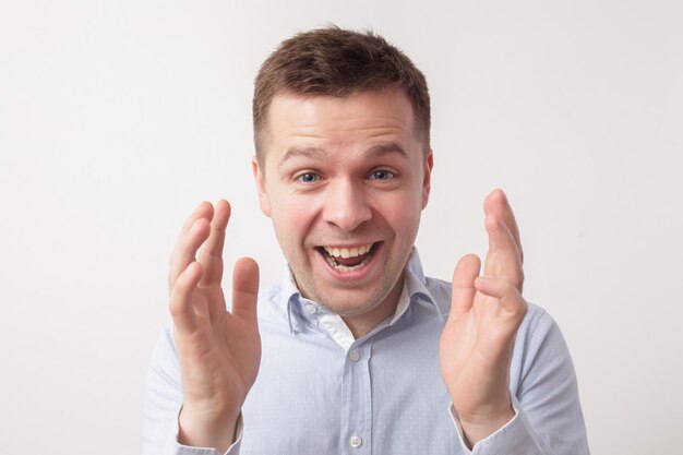 Man stretching his arms forward in surprise