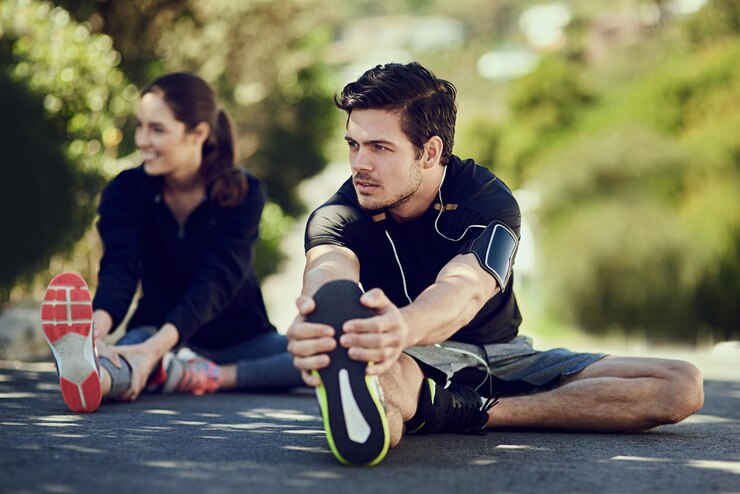 Photo man stretching legs and thinking before fitness exercise and workout on road outdoor male athlete woman and warm up for health wellness and flexibility with endurance or couple for motivation