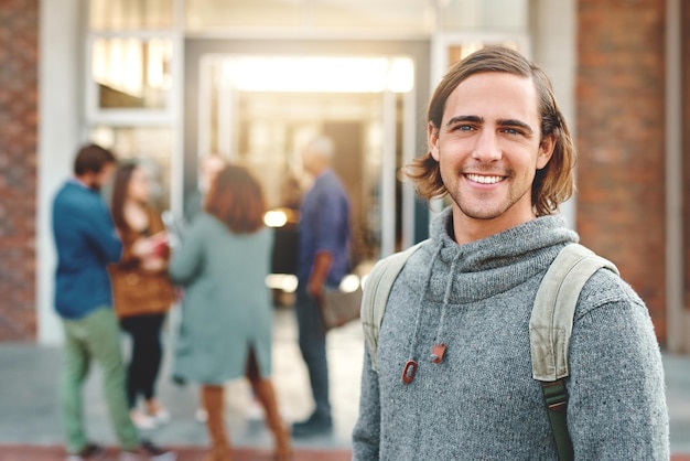 Man student and portrait in street happy or backpack for education learning or development at college Person smile and bag in metro road for scholarship study or pride at university in Munich