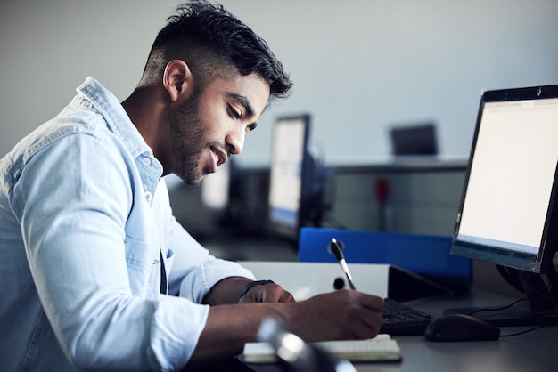 man student and thinking with writing in notebook at it college with smile for education with coding person e learning and notes for computer with programming study and problem solving in mumbai