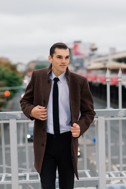 Man in a stylish suit. Businessman in an autumn city, fashion