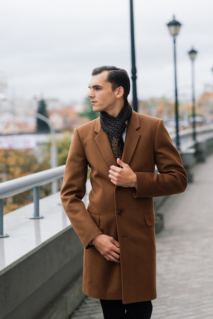 Man in a stylish suit posing outdoors