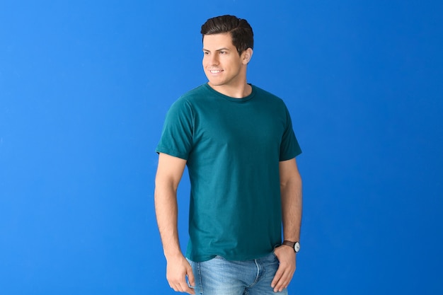 Man in stylish t-shirt on color