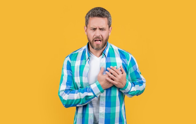 Man suffer with heartache in studio heartache suffer of caucasian man in shirt