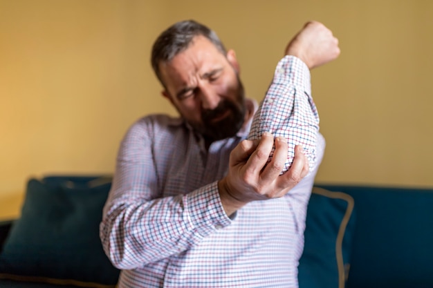 Man Suffering From Elbow Pain