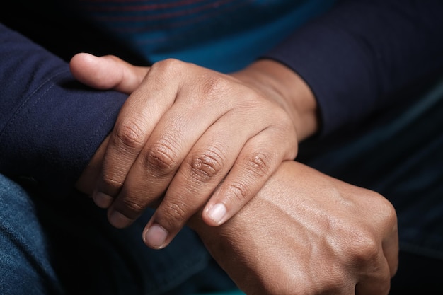 Man suffering pain in hand close up