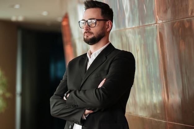 Man in suit and eyeglasses