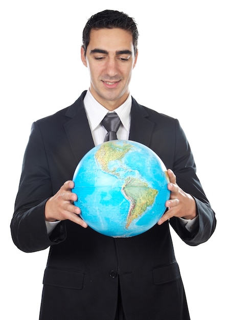 Man in a suit holding globe over white background