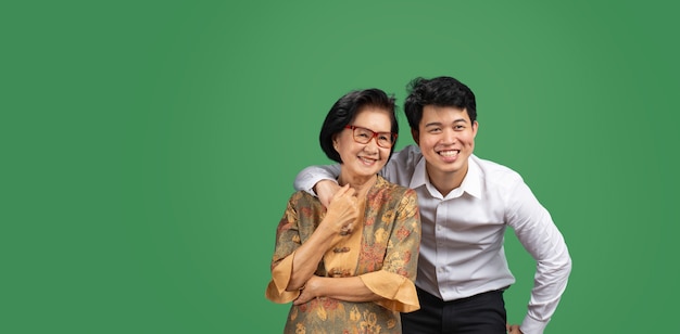 Man in suit hugging his mother