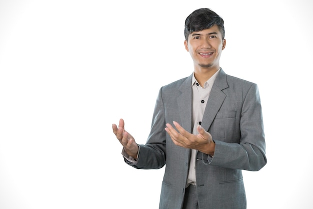 A man in a suit is clapping his hands