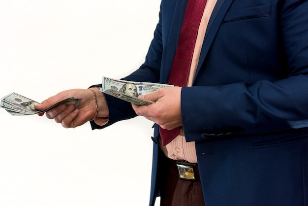 A man in a suit offers a bribe for a product or service