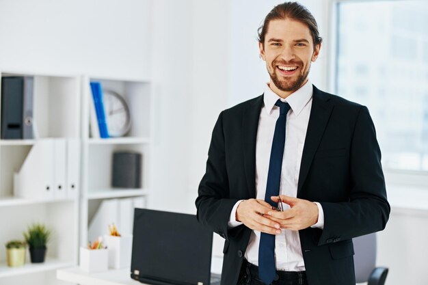 Man in a suit in the office with documents executive High quality photo