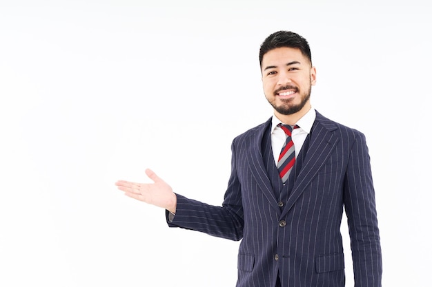 A man in a suit posing for guidance