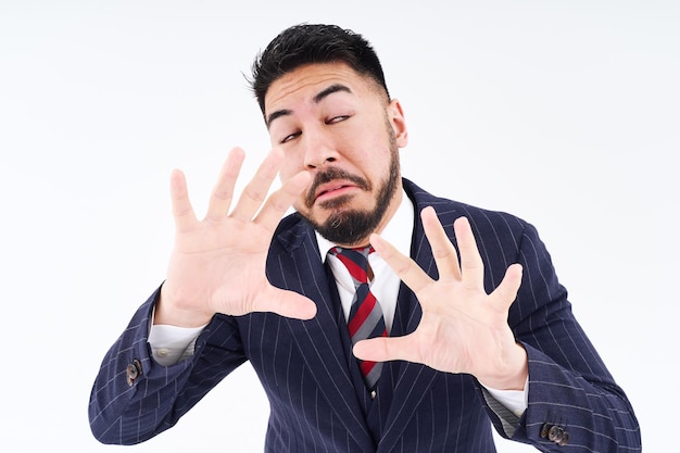 A man in a suit posing for refusal