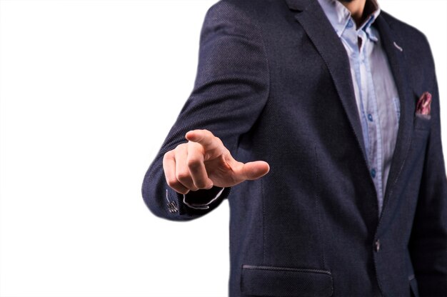 Man in a suit presses the finger on the display