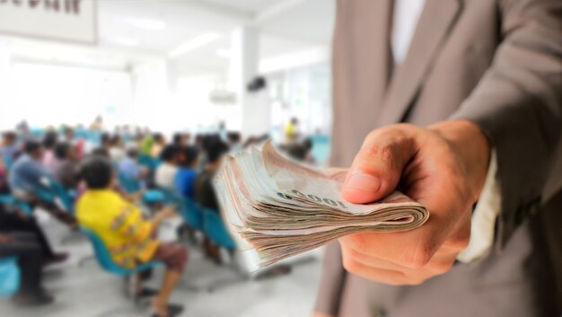 Man in suit showing money