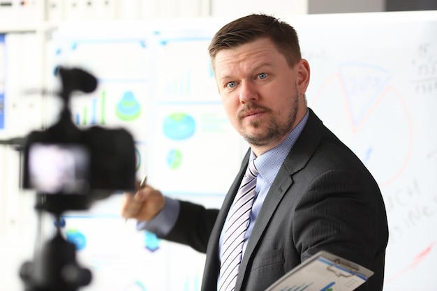 Man in suit and tie with graph