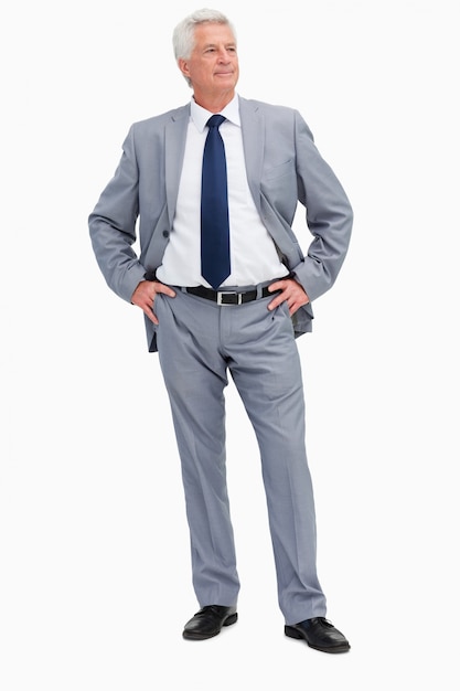 Man in a suit with his hands on his hips