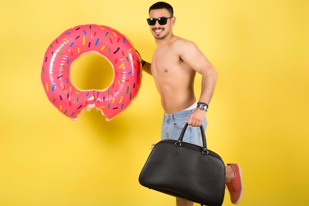 man in summer clothes hat jumping hold inflatable ring