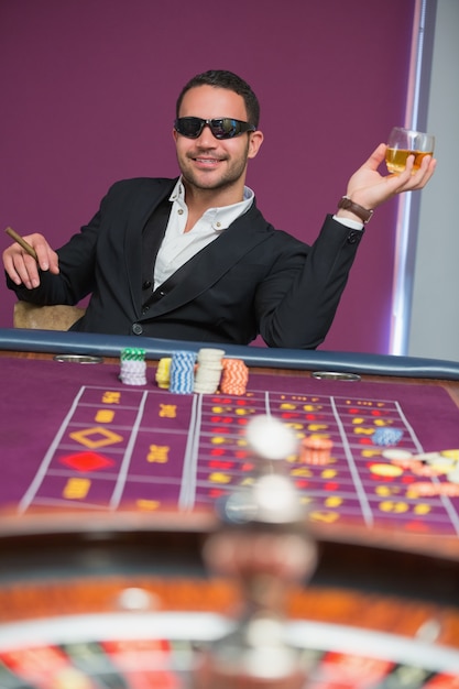 Man in sunglasses at roulette table