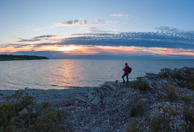 Man at sunset by the sea