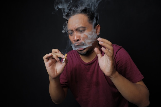 Man surprised after smoking a cigarette