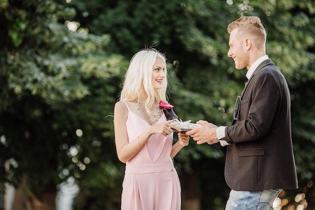 Man surprises his girlfriend with presentlove holiday celebration and family concept