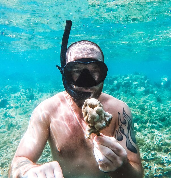 Man swimming in sea