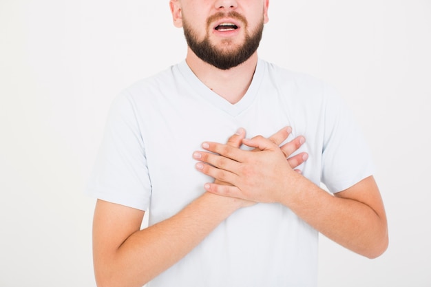 Man in t-shirt heaving heartache 