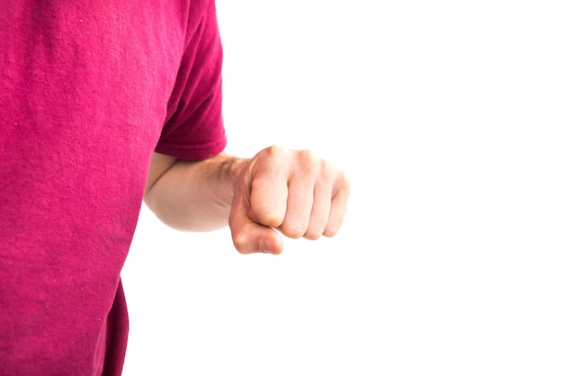 Man in t-shirt with clenched fist isolated on white background