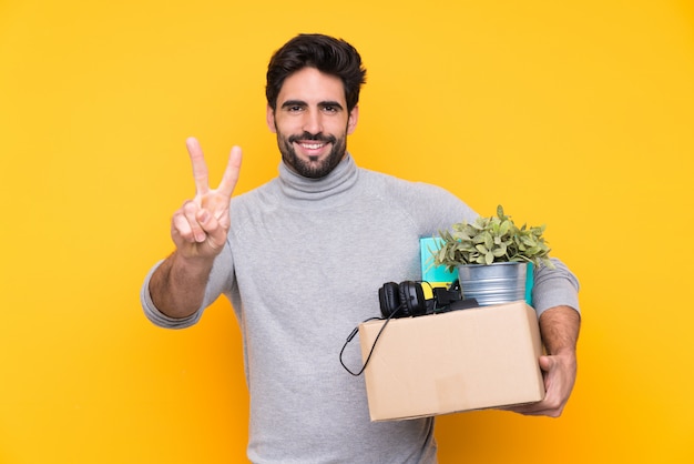 man taking a box full of things and making a move