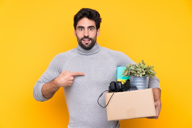 man taking a box full of things and making a move