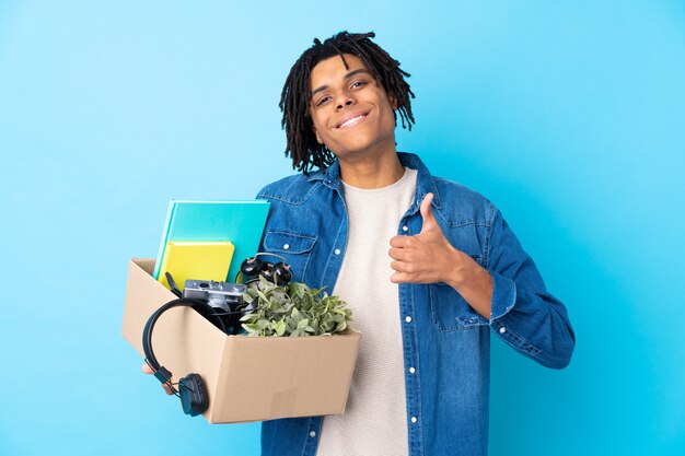 man taking a box full of things and making a move