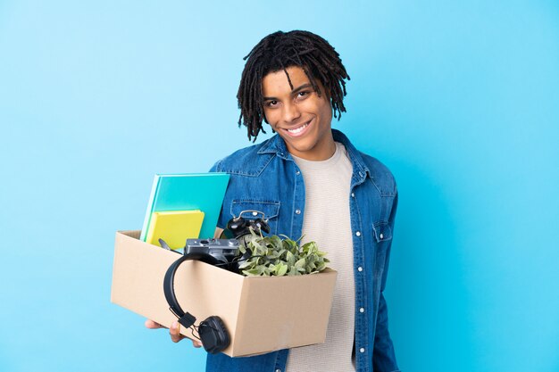 man taking a box full of things and making a move